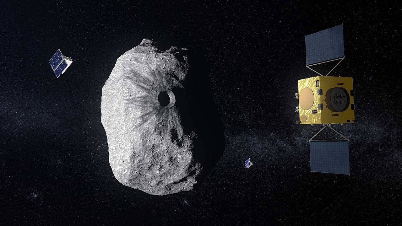 Ilustración de la nave Hera y los cubesats Milani y Juventas operando alrededor del asteroide Dimorfo.